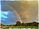 Arcobaleno in cielo in tempesta di vari colori