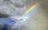 Immagine arcobaleno Arcobaleno seminascosto tra le nubi