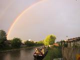 Immagine arcobaleno Arcobaleno sul fiumiciattolo con barca
