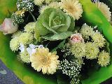 Immagine fiori Bouquet di fiori con incarto verde per un tenero pensiero