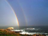 Immagine doppio Doppio arcobaleno che nasce dal mare