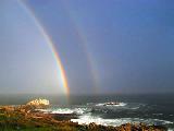 Immagine nasce Doppio arcobaleno che nasce dal mare