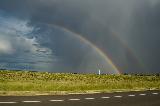 Immagine doppio arcobaleno Doppio arcobaleno che sparisce in un cielo molto nuvoloso