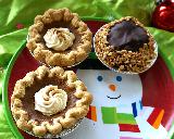 Immagine piatto Mini dolci deliziosi in piatto con disegnato pupazzo di neve