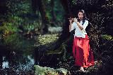 Immagine flauto Ragazza che suona flauto in bosco in stile fantasy